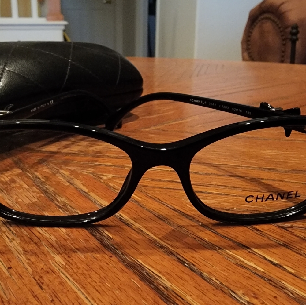 CHANEL black glitter frames with CHANEL bow tie.